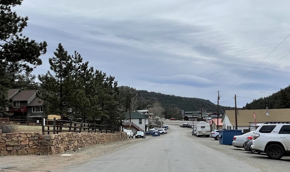 Buildings and cars along a quiet street 